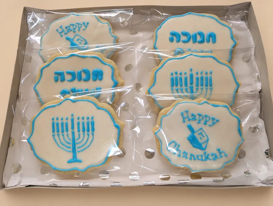 Chanukah boxed white and blue menorah and dreidel cookies