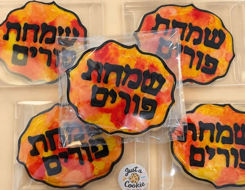 Individually wrapped orange marbled Purim cookies