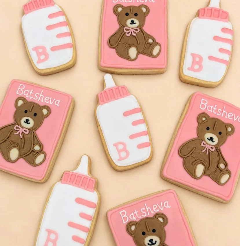 Pink baby bottle and teddy bear cookies personalized Batsheva